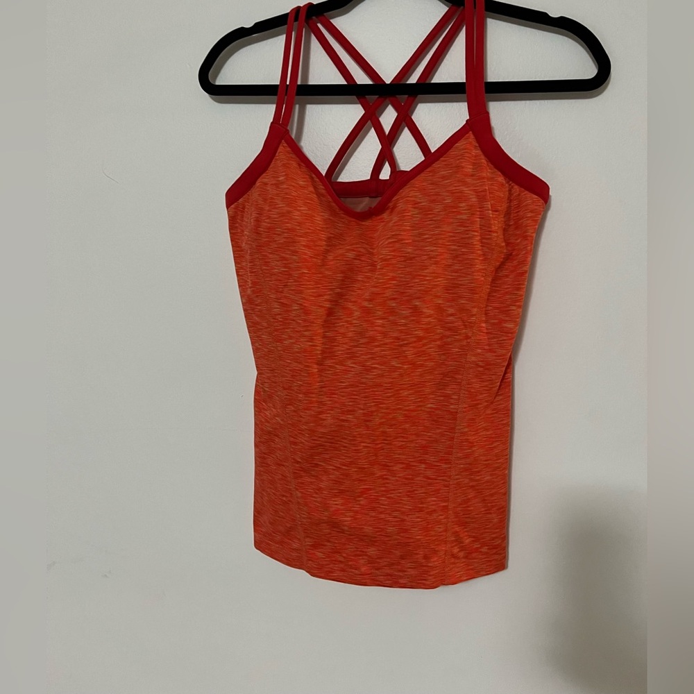 orange and red north face workout tank